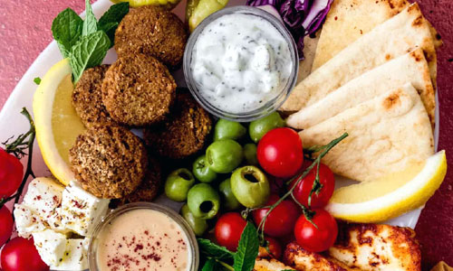 Falafel Plate Classic with tahini, pita, salad, and hummus